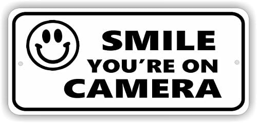 MySigncraft Smile Your'e на камера 4 x 9 Алуминиумски безбедносен знак со смајлно лице