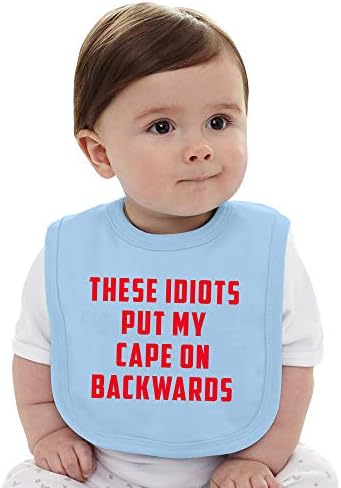 Овие идиоти ја ставаат мојата наметка наназад - суперхеројски сарказам шега за новороденче бебе Jerseyерси Биб